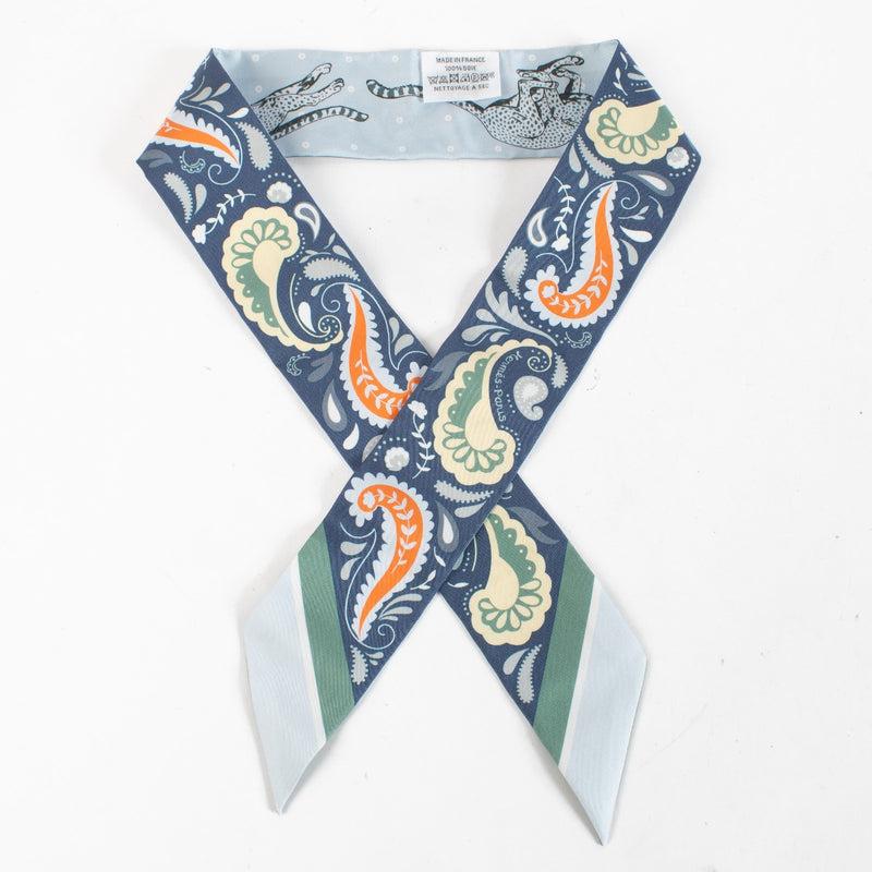 Are you looking for an authentic designer accessory? We buy and sell your preloved and brand new Hermès Blue Guepards Bandana Silk Twilly.