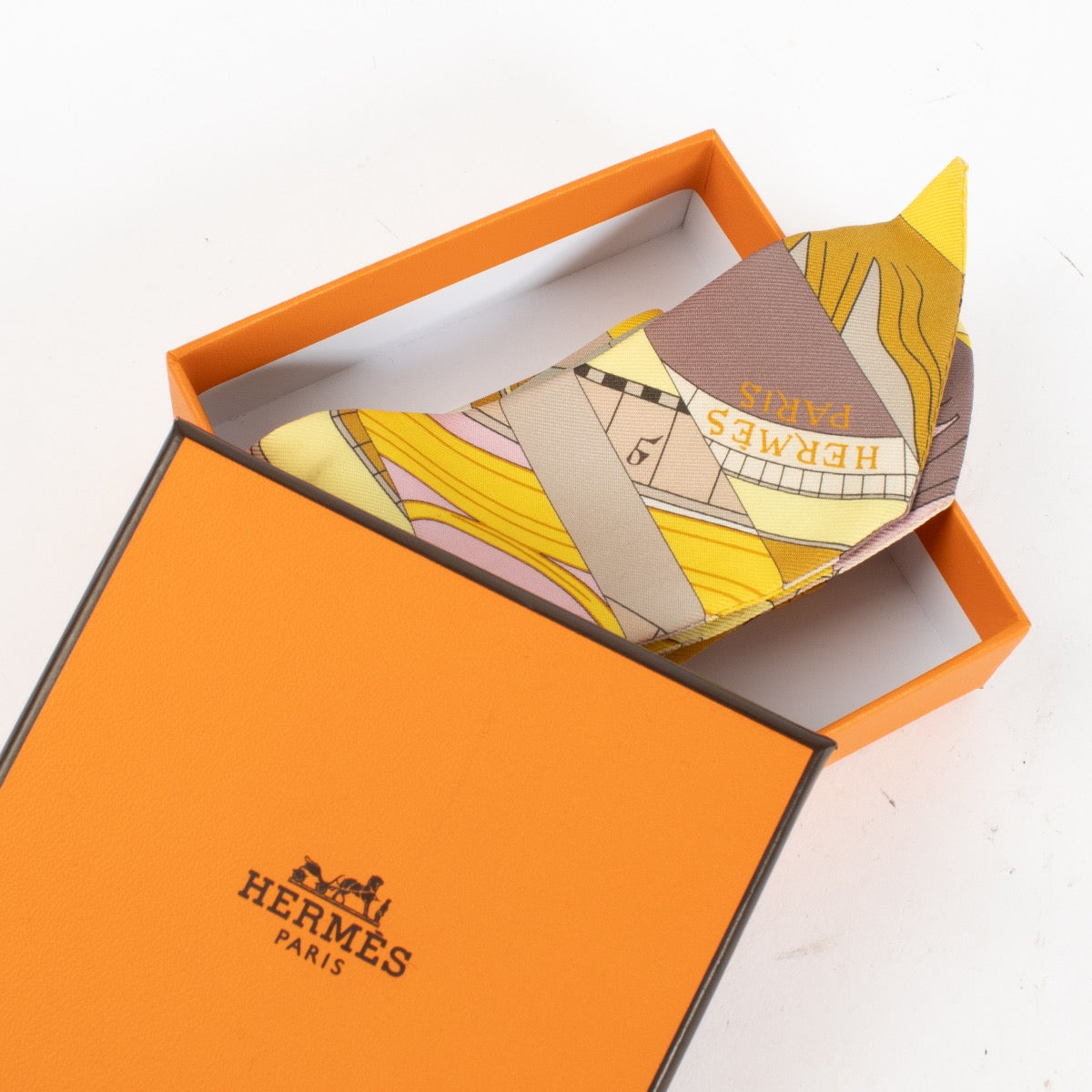 Hermès Yellow Astrologie Nouvelle Twilly Scarf for the best price at Labellov secondhand luxury in Antwerp and Knokke.