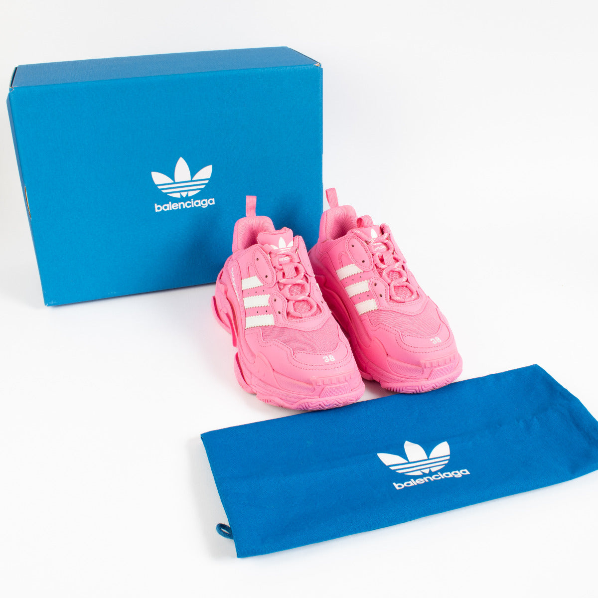 Bold, unapologetic, and rooted in fashion-forward design, the Balenciaga x Adidas Pink Triple S Sneakers are the epitome of luxury streetwear collaboration. Merging Balenciaga’s avant-garde aesthetic with Adidas’ iconic sportswear heritage, this striking