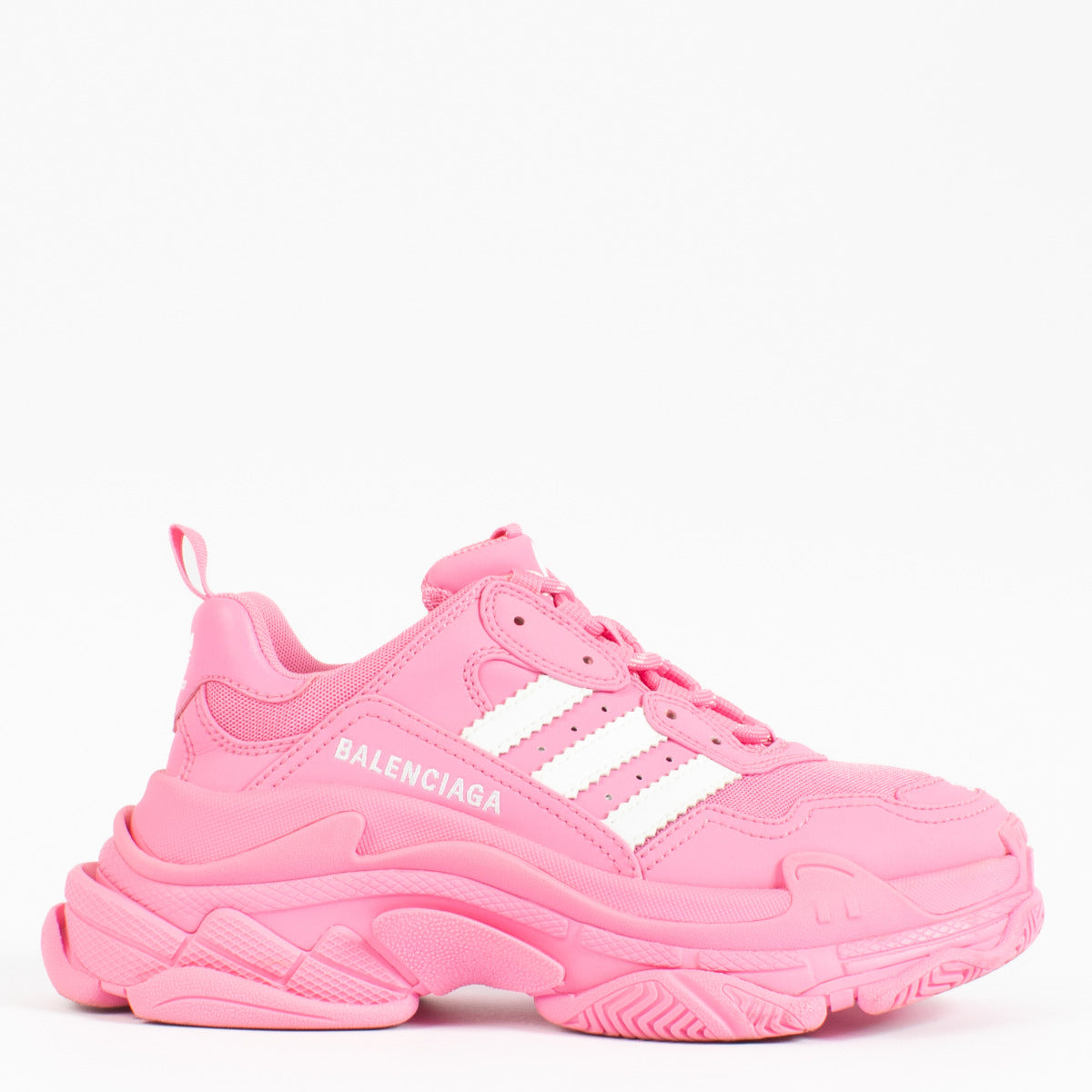 Bold, unapologetic, and rooted in fashion-forward design, the Balenciaga x Adidas Pink Triple S Sneakers are the epitome of luxury streetwear collaboration. Merging Balenciaga’s avant-garde aesthetic with Adidas’ iconic sportswear heritage, this striking