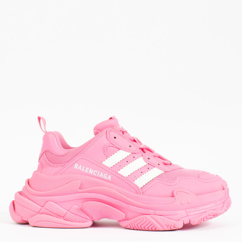 Bold, unapologetic, and rooted in fashion-forward design, the Balenciaga x Adidas Pink Triple S Sneakers are the epitome of luxury streetwear collaboration. Merging Balenciaga’s avant-garde aesthetic with Adidas’ iconic sportswear heritage, this striking