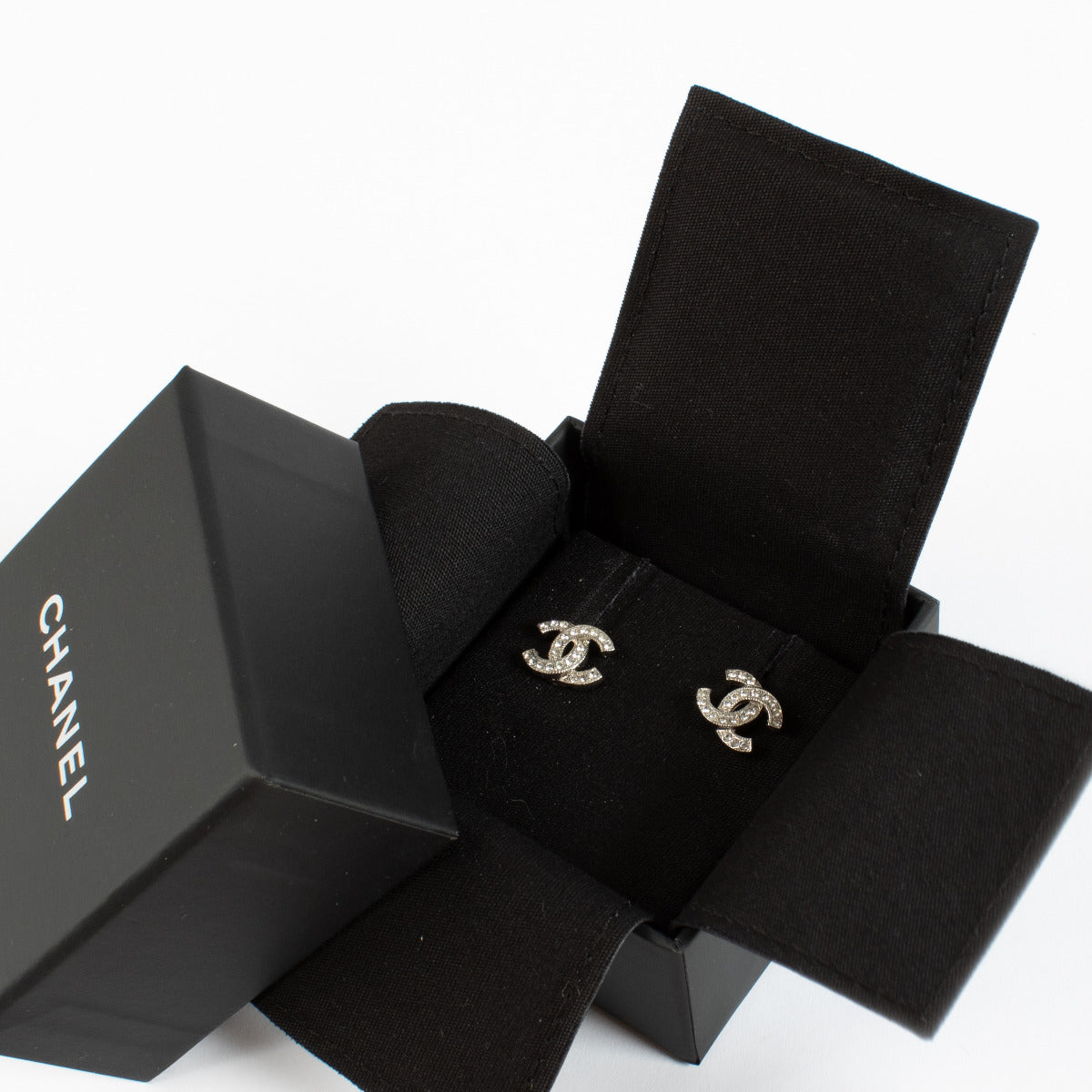 Chanel crystal-embellished CC stud earrings.