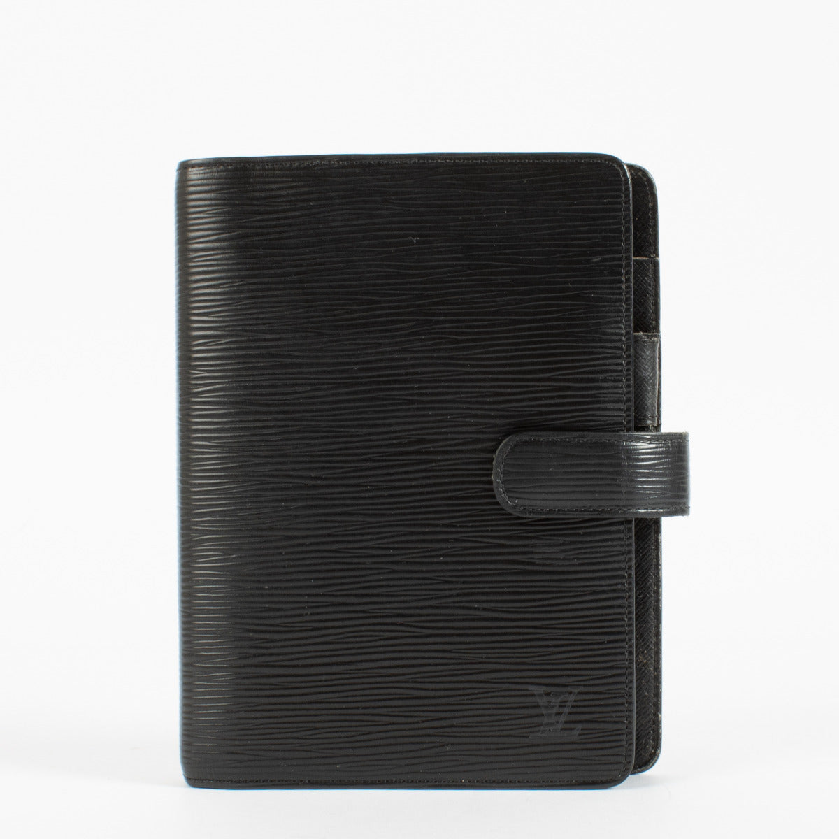 Elevate your everyday organization with the timeless sophistication of this Louis Vuitton Medium Agenda Cover in signature Black Epi leather. Crafted in the Maison’s iconic textured calfskin, this agenda strikes a refined balance between utility and style