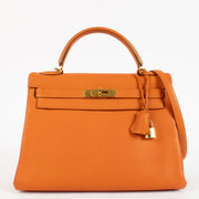 Authentic second hand vintage designer luxury Hermès Kelly 32 Orange Togo GHW on www.labellov.com