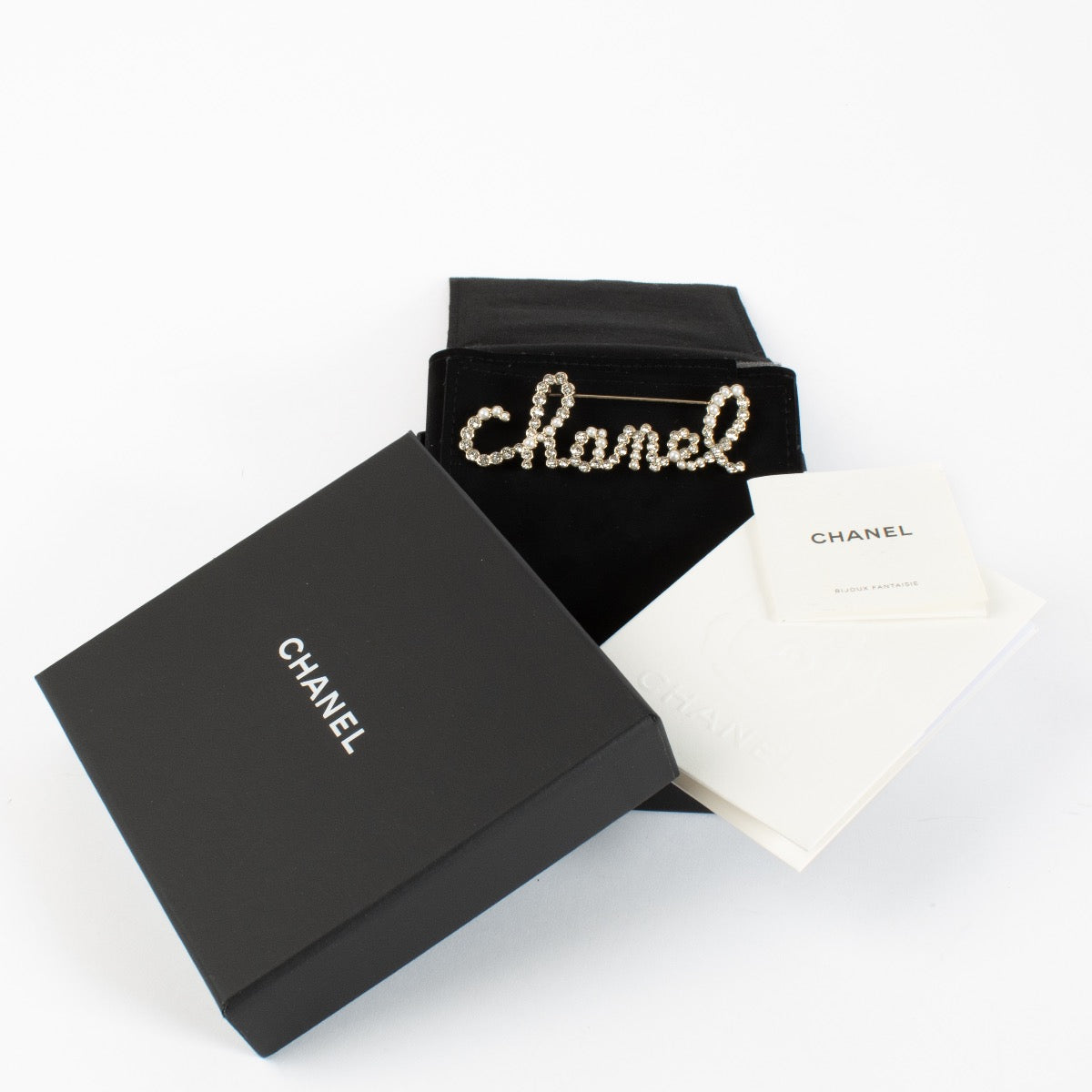 authentic preloved Chanel 19K Silver Logo Brooch on Labellov.com