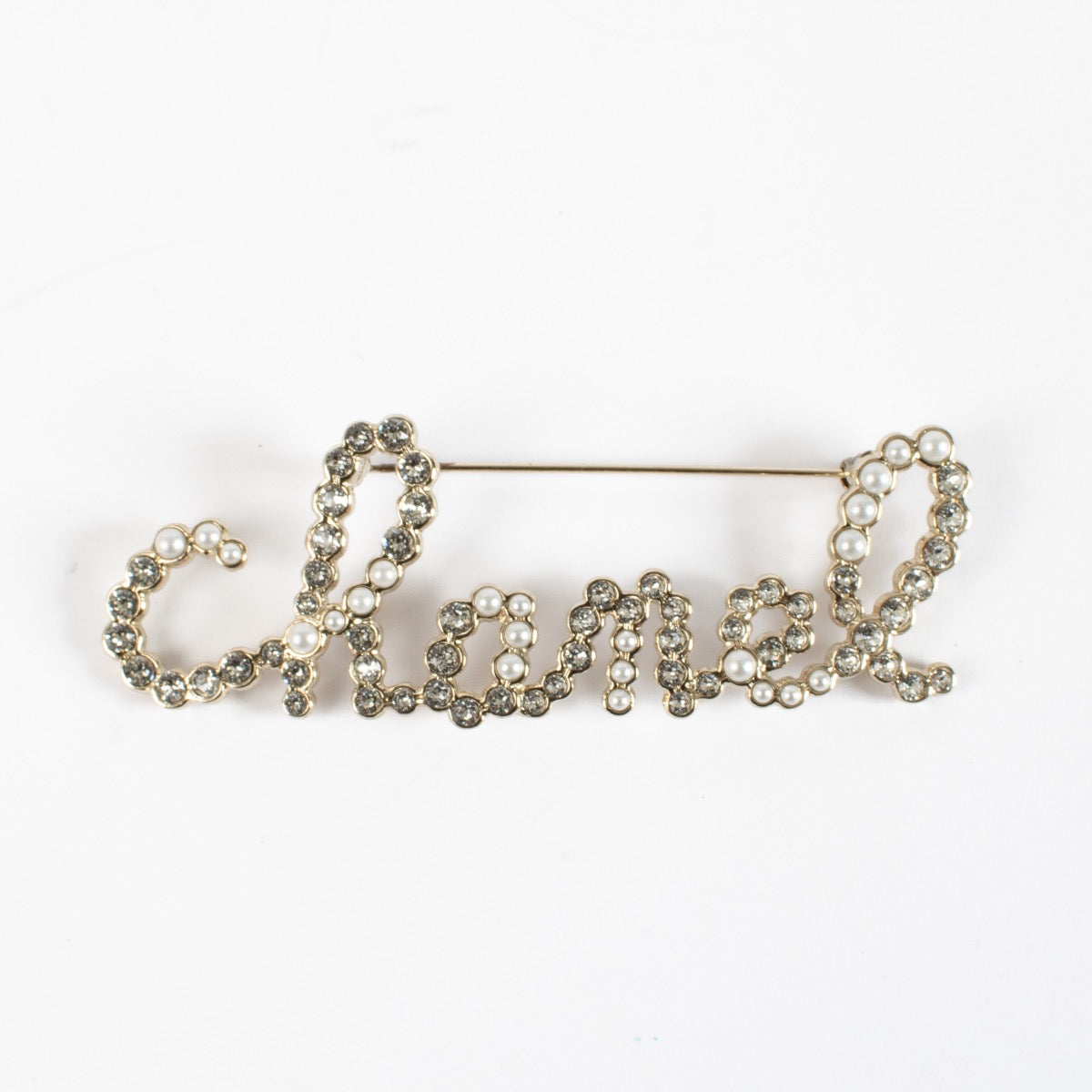 authentic preloved Chanel 19K Silver Logo Brooch on Labellov.com