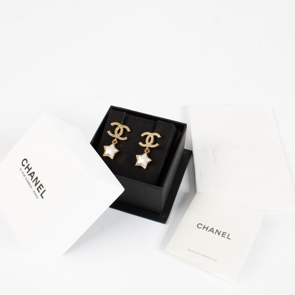 Authentic pre-loved Chanel Crystal CC Star Earrings Gold Tone 24C on Labellov.com