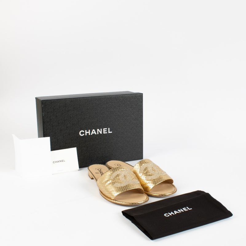 Authentic pre-loved Chanel Gold Lambskin Perforated CC Slide Sandals — Size 41 on Labellov.com