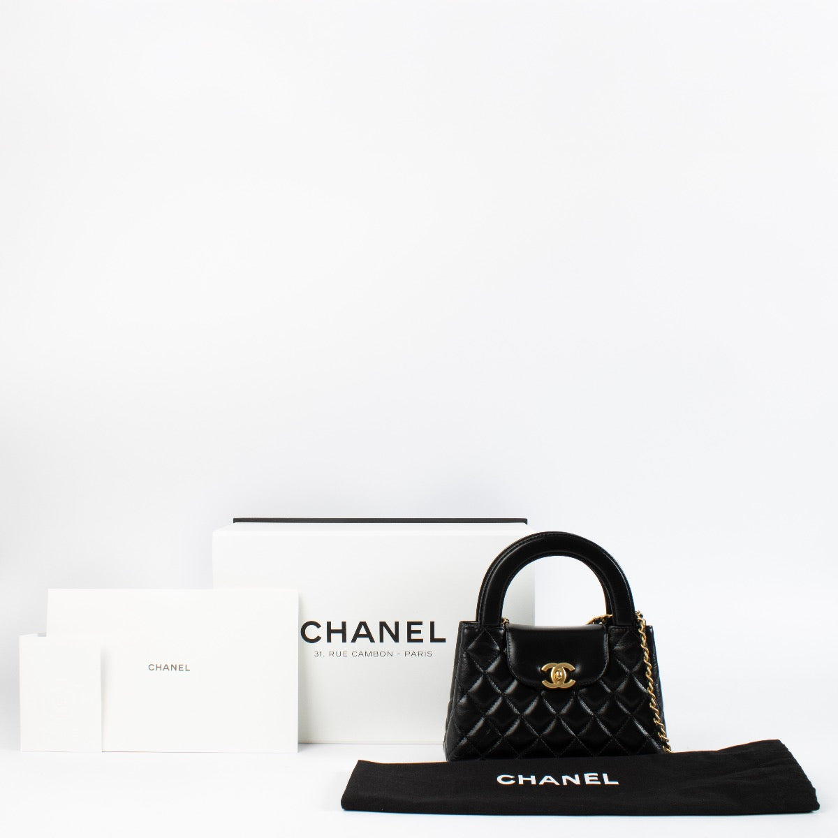 shop 100% authentic second hand Chanel Black Lambskin Kelly Nano Top Handle Bag on Labellov.com