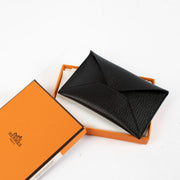 Authentic pre-loved Hermès Black MM Envelope Card Holder on Labellov.com