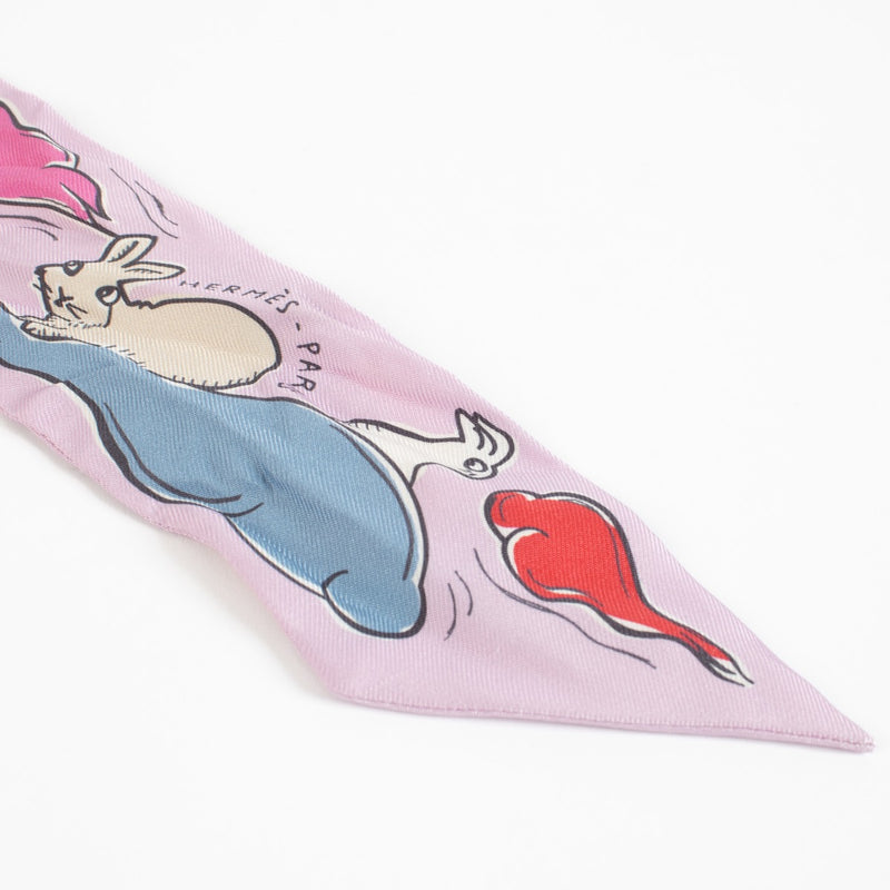 authentic preloved Hermès Mille et Un Lapins Pink Twilly Scarf on Labellov.com