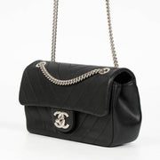 Authentic pre-loved Chanel Black Chevron Calfskin Mini Classic Rectangular Bag on Labellov.com