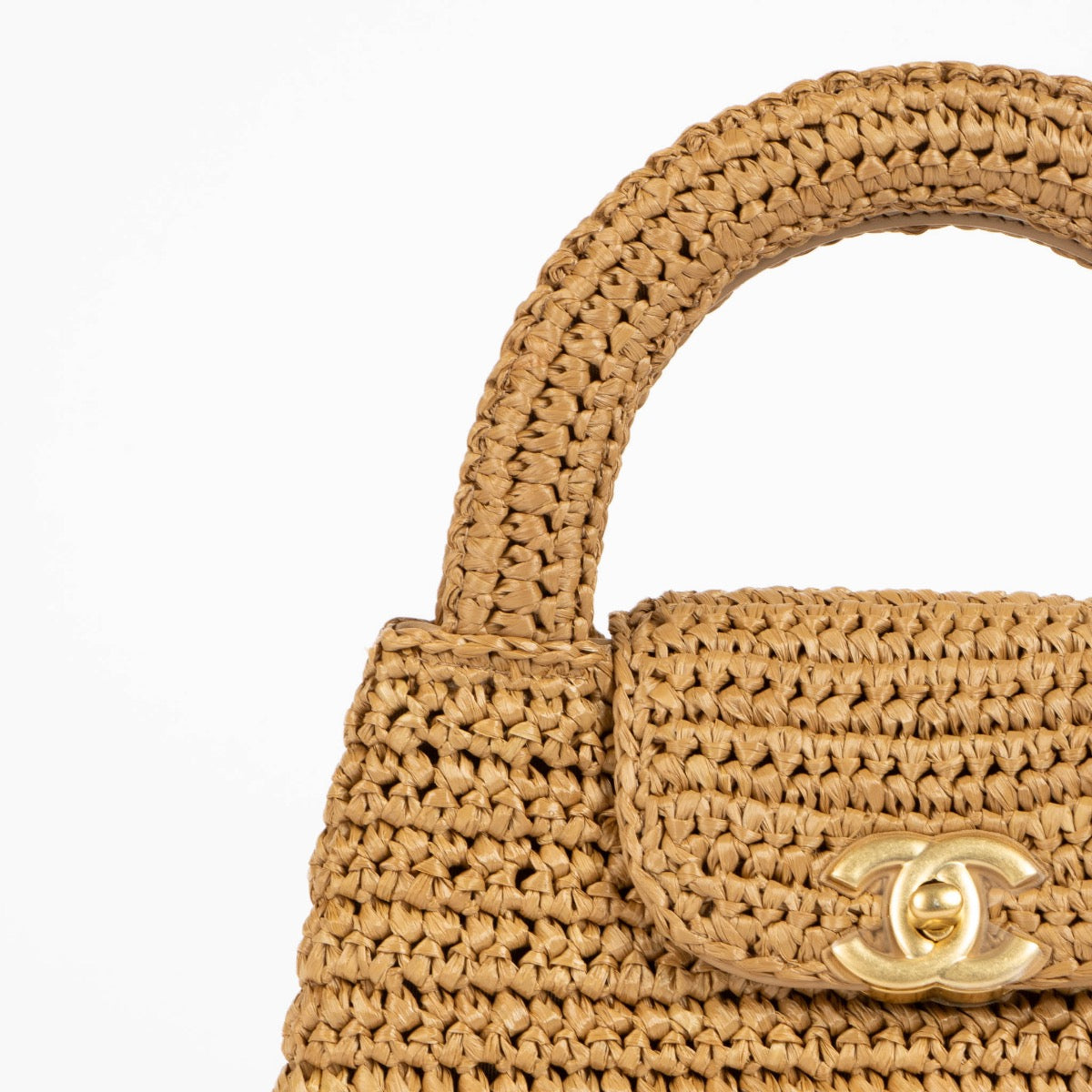 Shop safe online at Labellov in Antwerp, Brussels and Knokke this 100% authentic second hand Chanel Dark Beige Braided Raffia Kelly Nano Bag