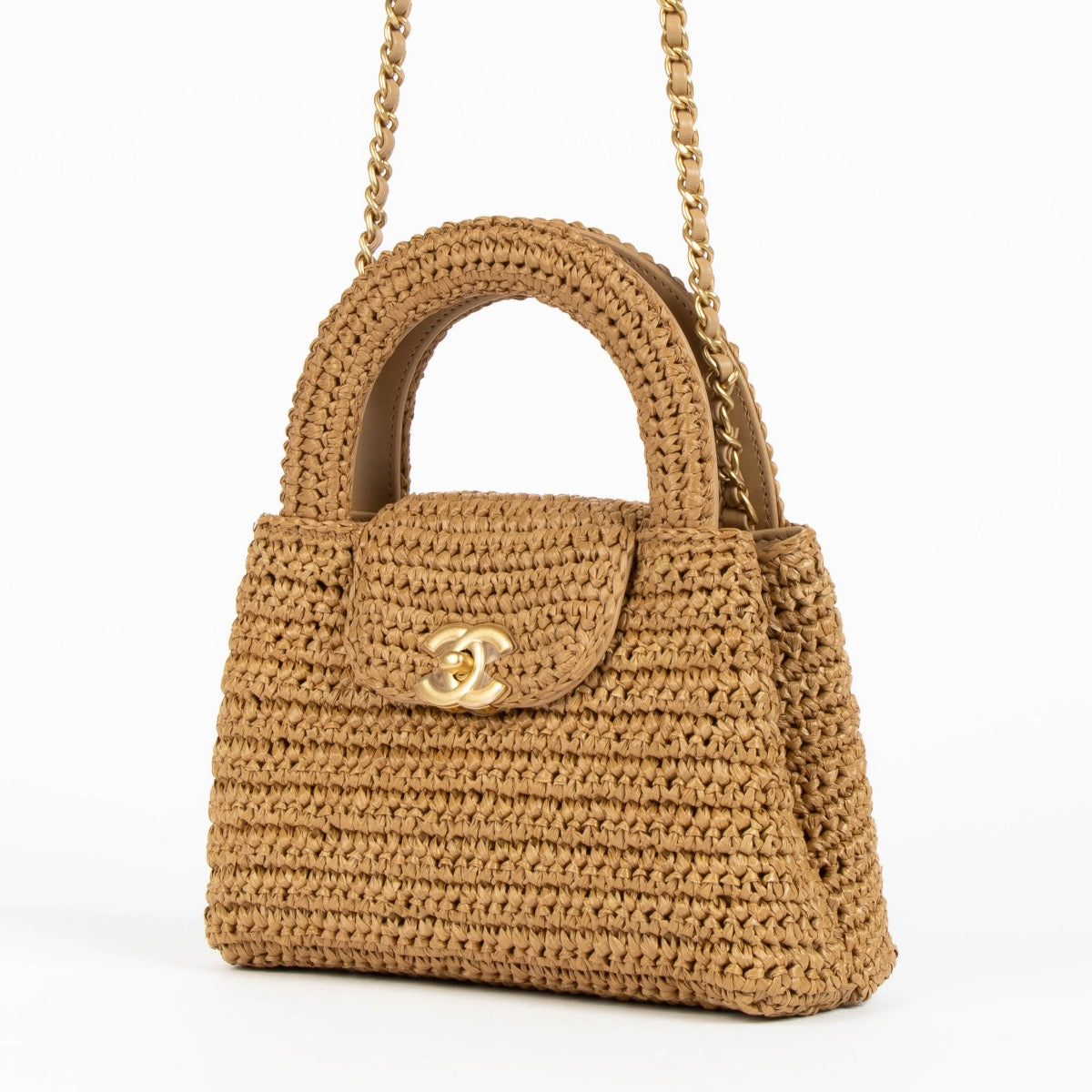 Shop safe online at Labellov in Antwerp, Brussels and Knokke this 100% authentic second hand Chanel Dark Beige Braided Raffia Kelly Nano Bag