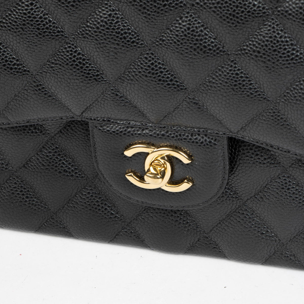 Authentic pre-loved Chanel Black Caviar Large / Jumbo Classic Bag on Labellov.com