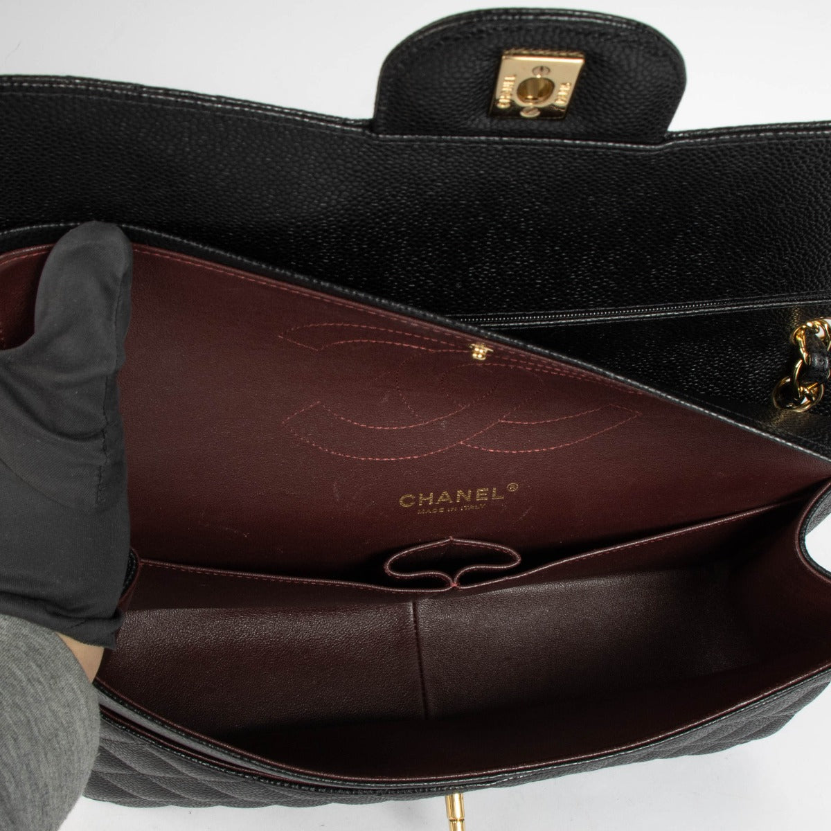 Authentic pre-loved Chanel Black Caviar Large / Jumbo Classic Bag on Labellov.com