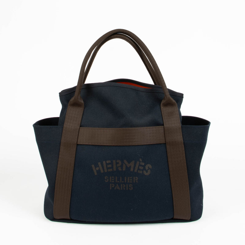 Hermès Bleu Navy Feu Toile Sac De Pasnage Groom Top Handle Bag for the best price at Labellov secondhand luxury