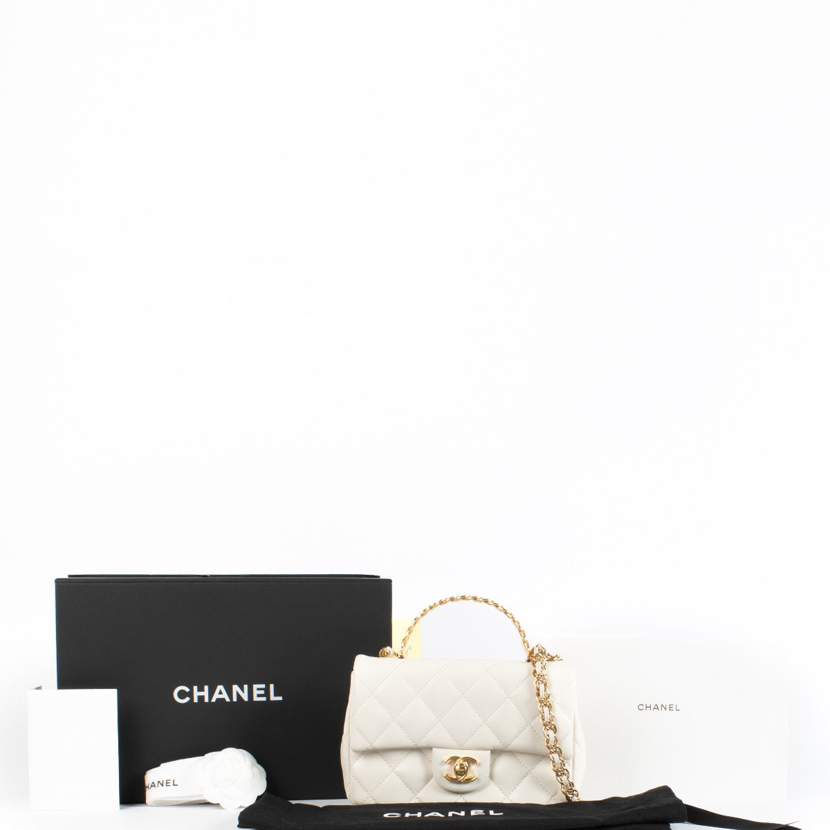 shop 100% authentic second hand Chanel Off White Quilted Lambskin Mini Top Handle Bag on Labellov.com
