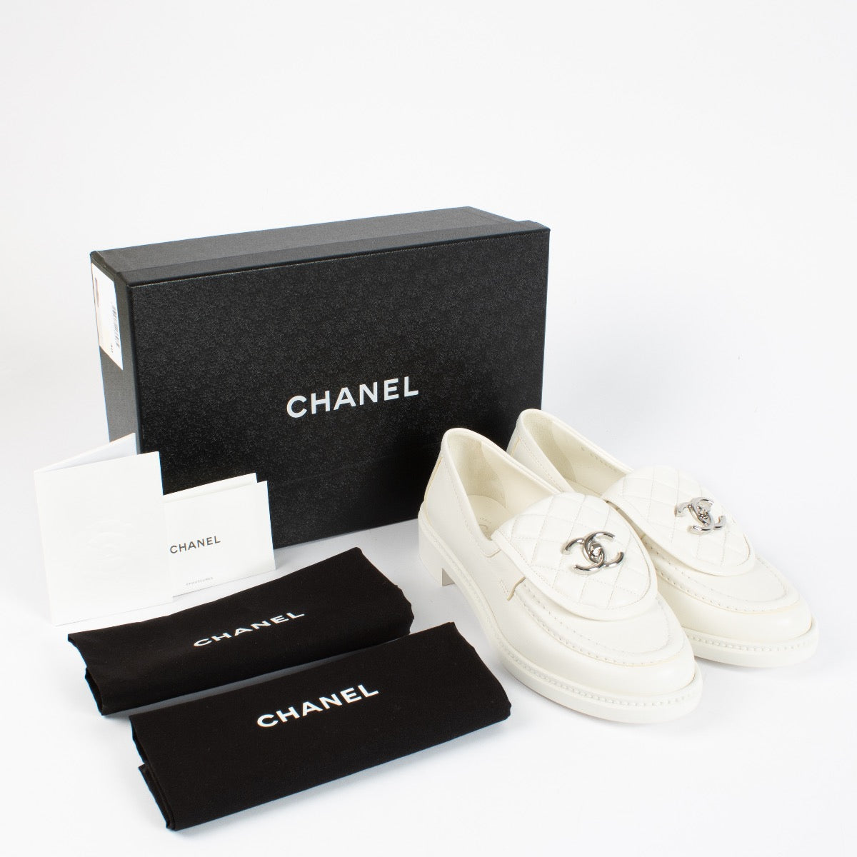 shop 100% authentic second hand Chanel White Quilted CC Turnlock Loafers - Size 40 on Labellov.com