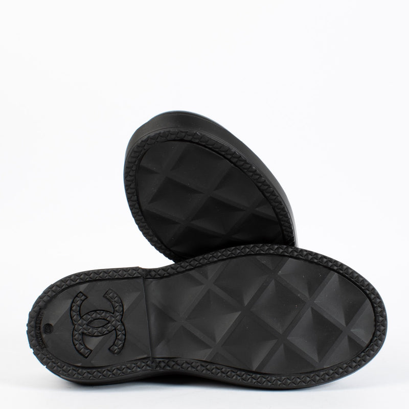 Authentic pre-loved Chanel Black Coco Mark Rubber Slip-On Shoes — Size 39 on Labellov.com