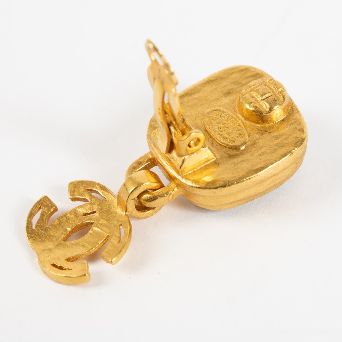 Authentic pre-loved Chanel All Gold 97A Clip Earrings on Labellov.com