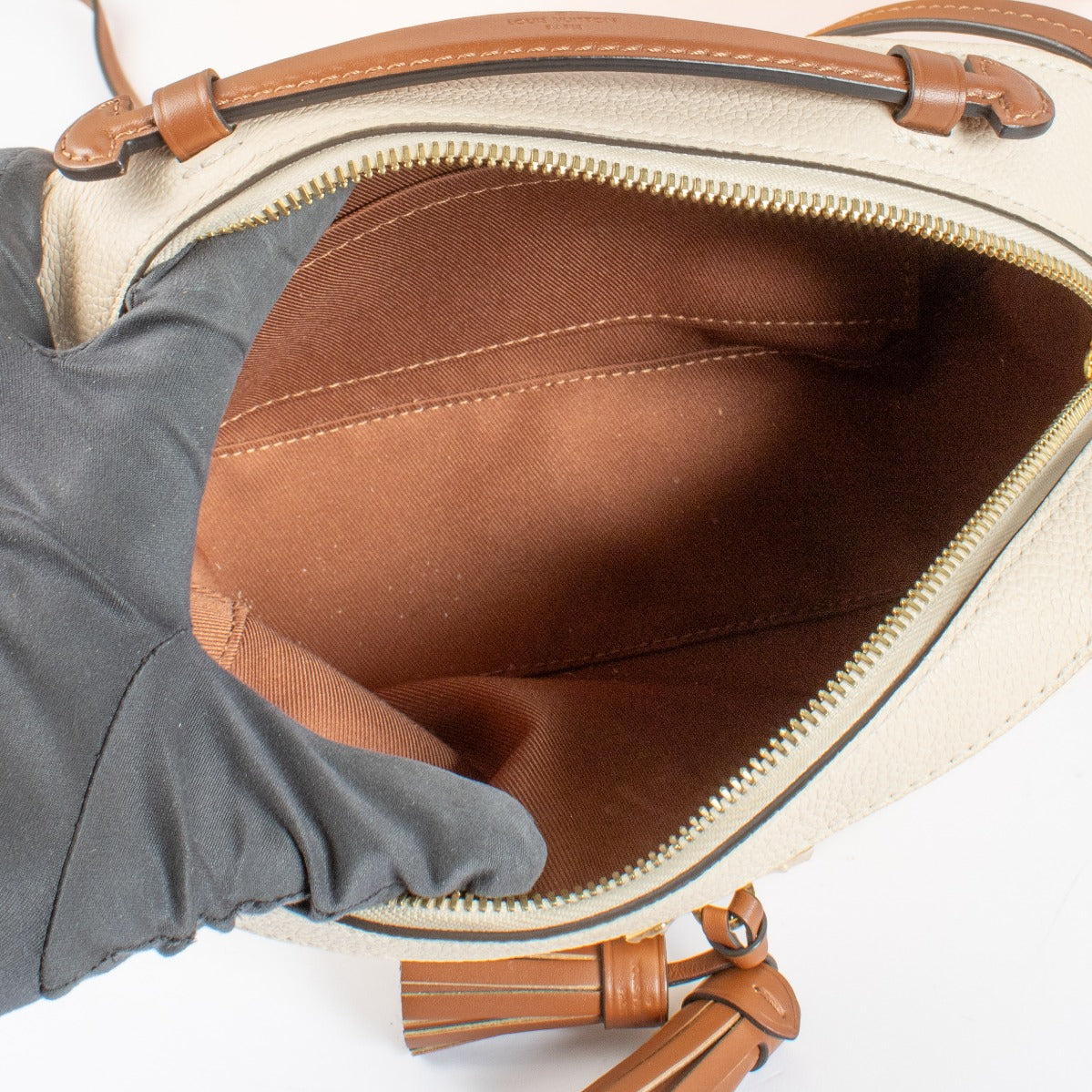 Authentic pre-loved Louis Vuitton Cream Monogram Empreinte Saintonge Bag on Labellov.com
