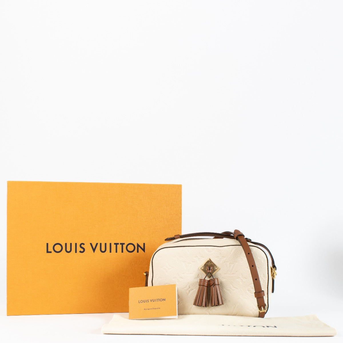 Authentic pre-loved Louis Vuitton Cream Monogram Empreinte Saintonge Bag on Labellov.com