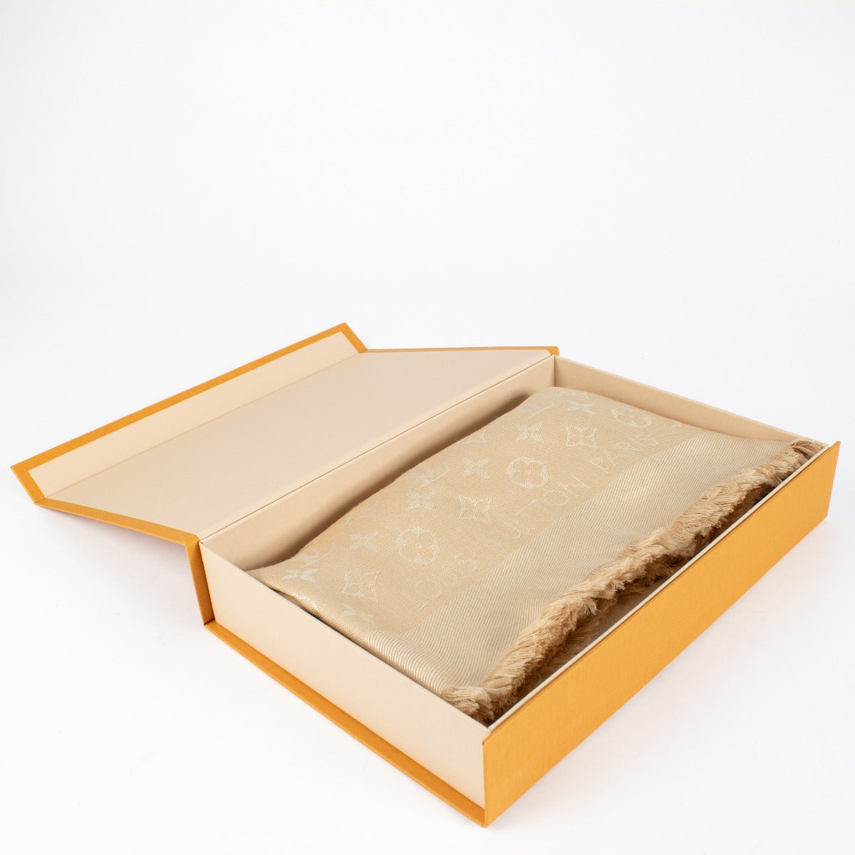 Authentic pre-loved Louis Vuitton Beige Monogram Classic Shawl on Labellov.com