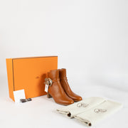 Authentic Hermès Frenchie 50 Ankle Boots in gold calfskin leather size 37 at Labellov.com