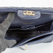 Authentic pre-loved Chanel Navy Blue Caviar Small Classic Flap Bag on Labellov.com