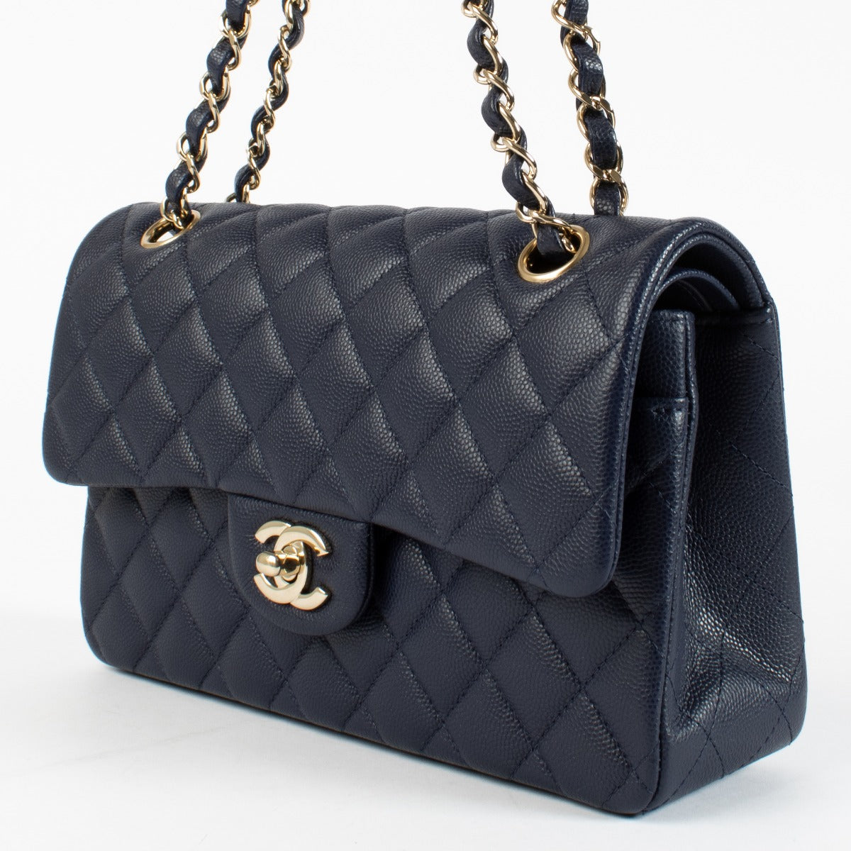 Authentic pre-loved Chanel Navy Blue Caviar Small Classic Flap Bag on Labellov.com