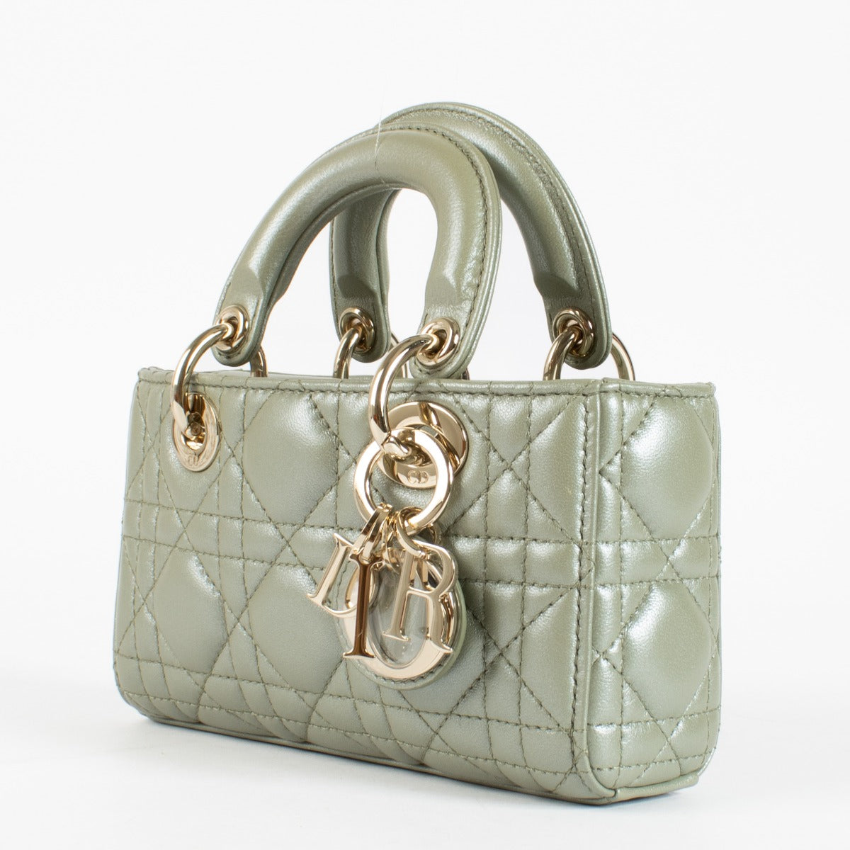 Dior Lady D-Joy bag in pastel Peyote green lambskin with gold hardware. A refined East-West Dior icon in excellent pre-loved condition.