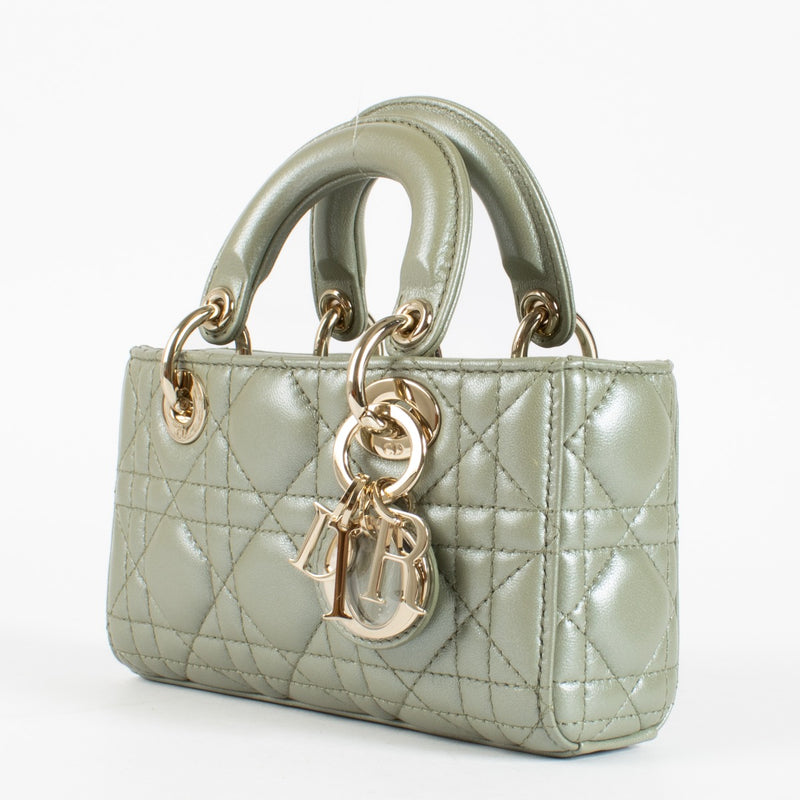 Dior Lady D-Joy bag in pastel Peyote green lambskin with gold hardware. A refined East-West Dior icon in excellent pre-loved condition.