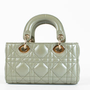 Dior Lady D-Joy bag in pastel Peyote green lambskin with gold hardware. A refined East-West Dior icon in excellent pre-loved condition.