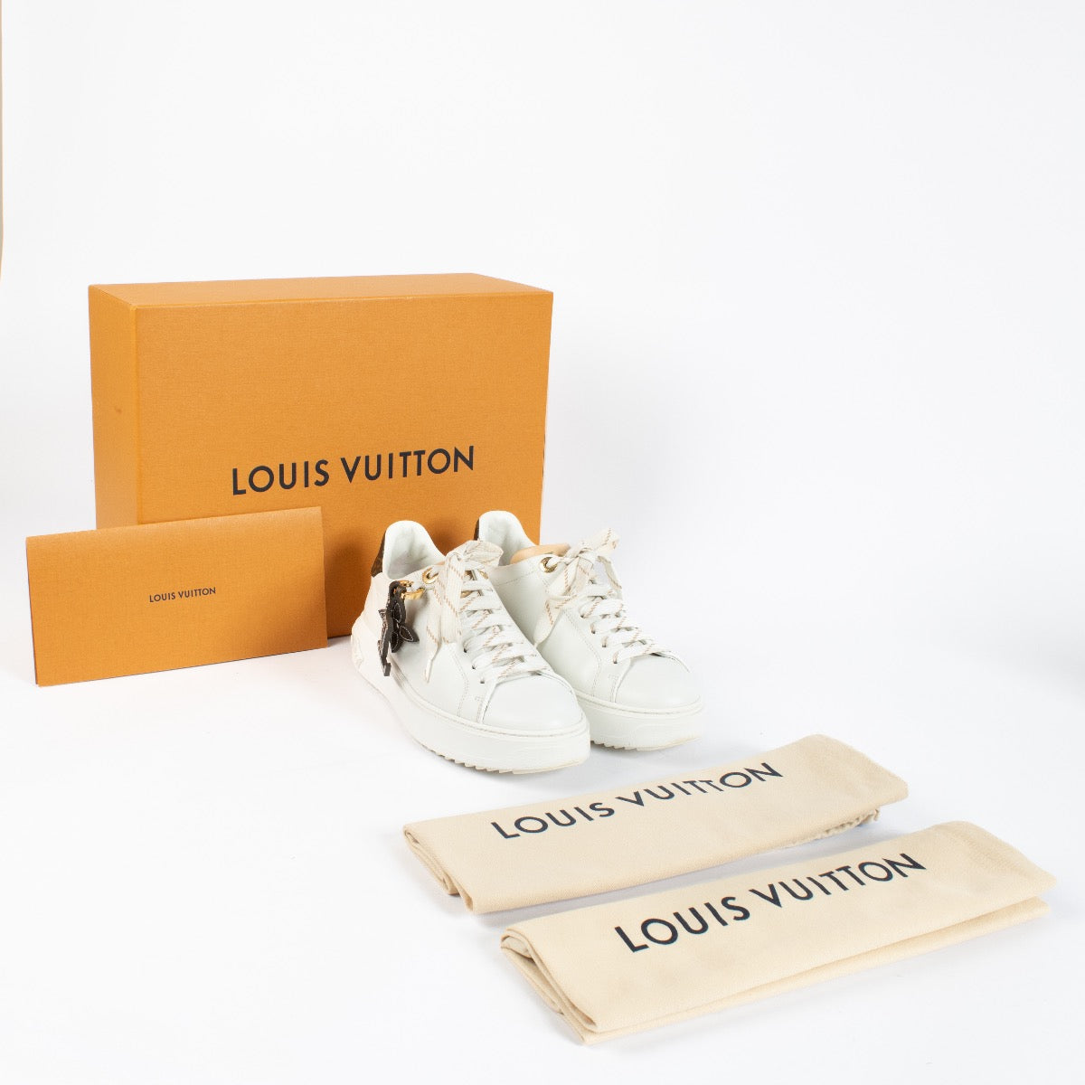 Authentic pre-loved Louis Vuitton White Time Out Sneakers – Size 37 on Labellov.com