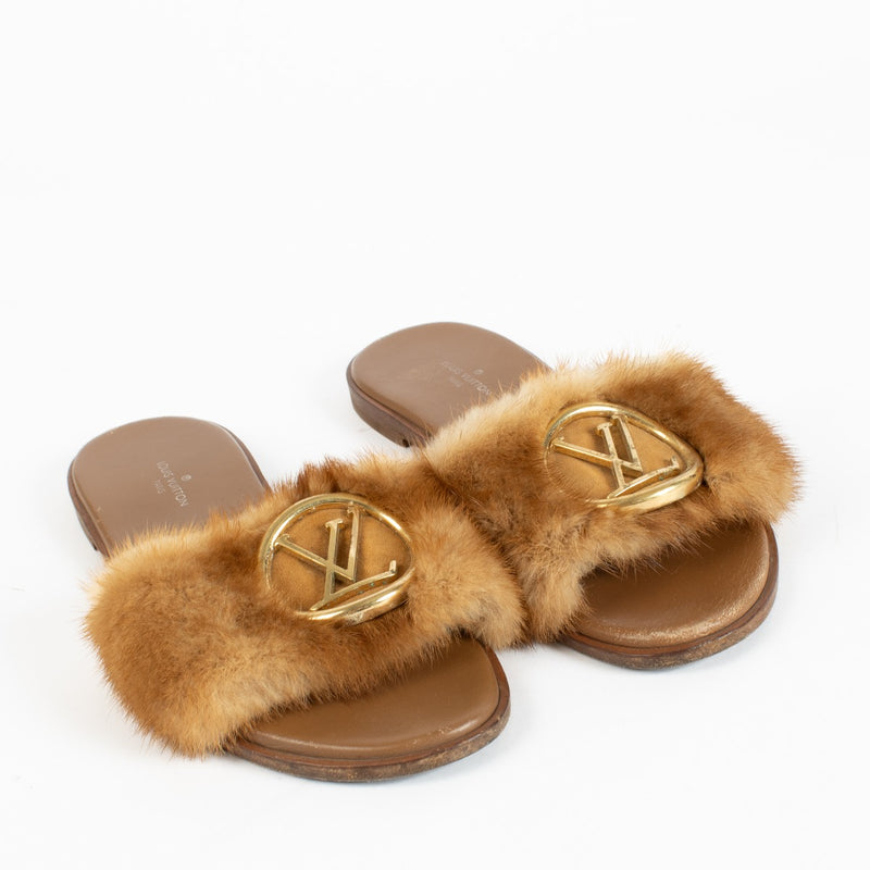 Authentic pre-loved Louis Vuitton Lock It Mink Fur Mule Sandals – Size 37 on Labellov.com