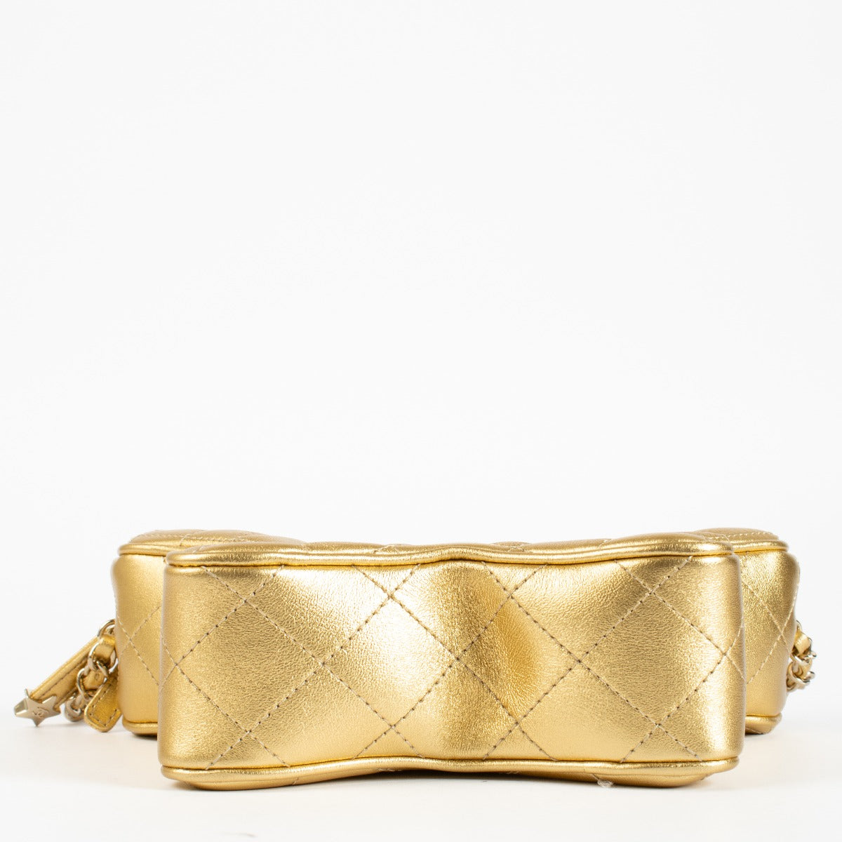 Authentic pre-loved Chanel Metallic Gold Leather Star Bag on Labellov.com