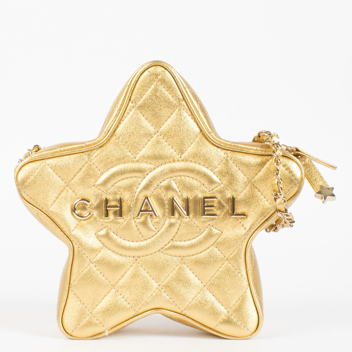 Authentic pre-loved Chanel Metallic Gold Leather Star Bag on Labellov.com