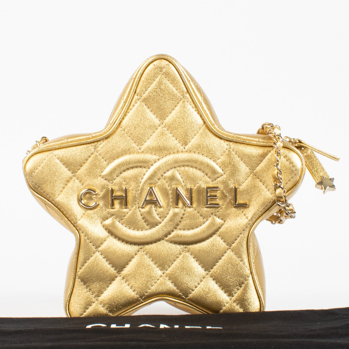 Authentic pre-loved Chanel Metallic Gold Leather Star Bag on Labellov.com