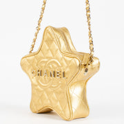 Authentic pre-loved Chanel Metallic Gold Leather Star Bag on Labellov.com
