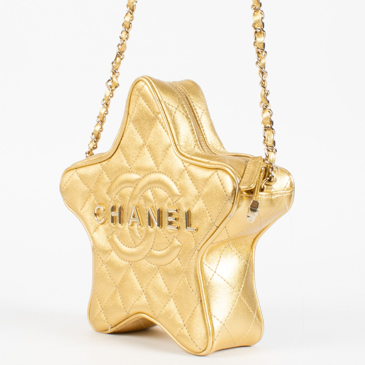 Authentic pre-loved Chanel Metallic Gold Leather Star Bag on Labellov.com