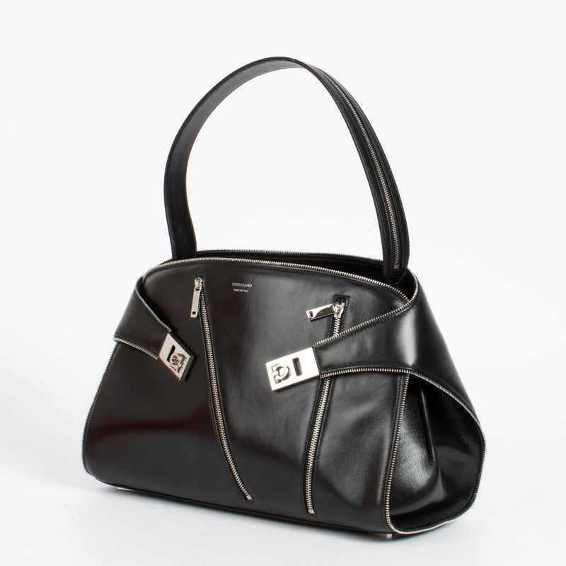 Shop the authentic Ferragamo Black Multi Zip Medium Hug Soft Bag on Labellov.com