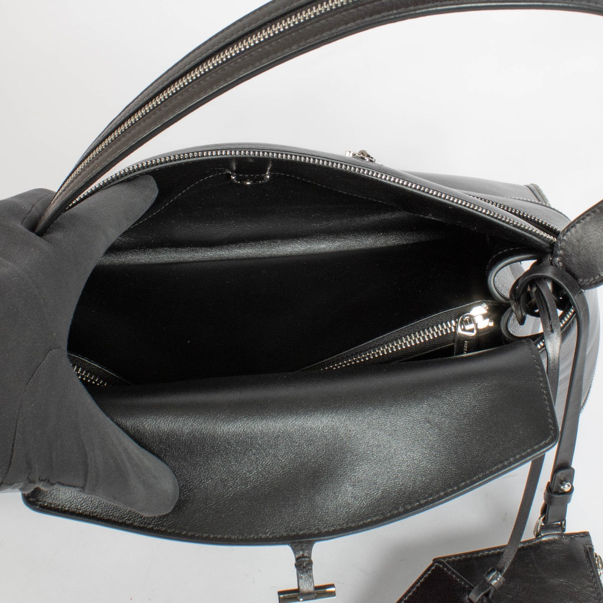 Shop the authentic Ferragamo Black Multi Zip Medium Hug Soft Bag on Labellov.com
