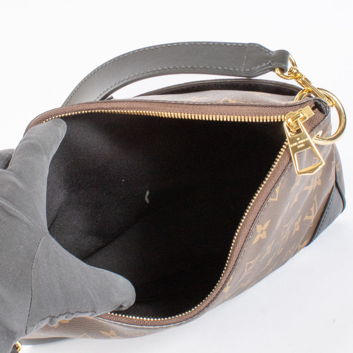 Louis Vuitton Odeon MM Monogram Canvas with black leather trim and gold-tone hardware. A chic, versatile everyday bag in excellent condition.