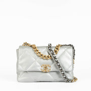 Shop this authentic Chanel Silver Lambskin Large Chanel 19 Bag pre-loved on Labellov.com