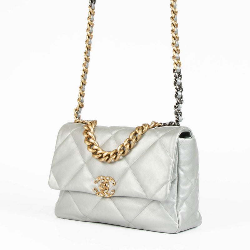 Shop this authentic Chanel Silver Lambskin Large Chanel 19 Bag pre-loved on Labellov.com