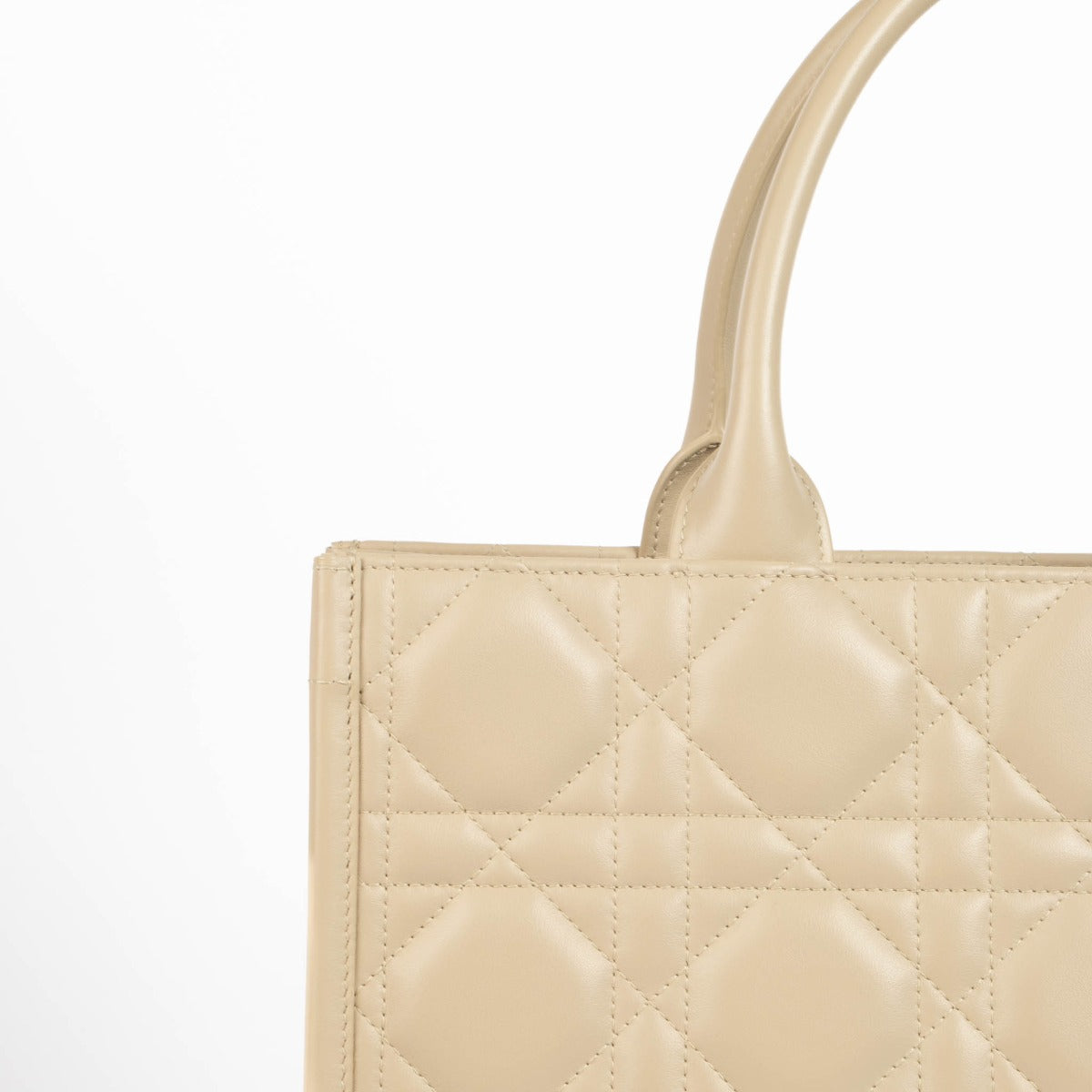 Christian Dior Book Tote sand embroidered canvas handbag, luxury designer tote with Dior logo pattern, neutral structured everyday bag for travel and city use