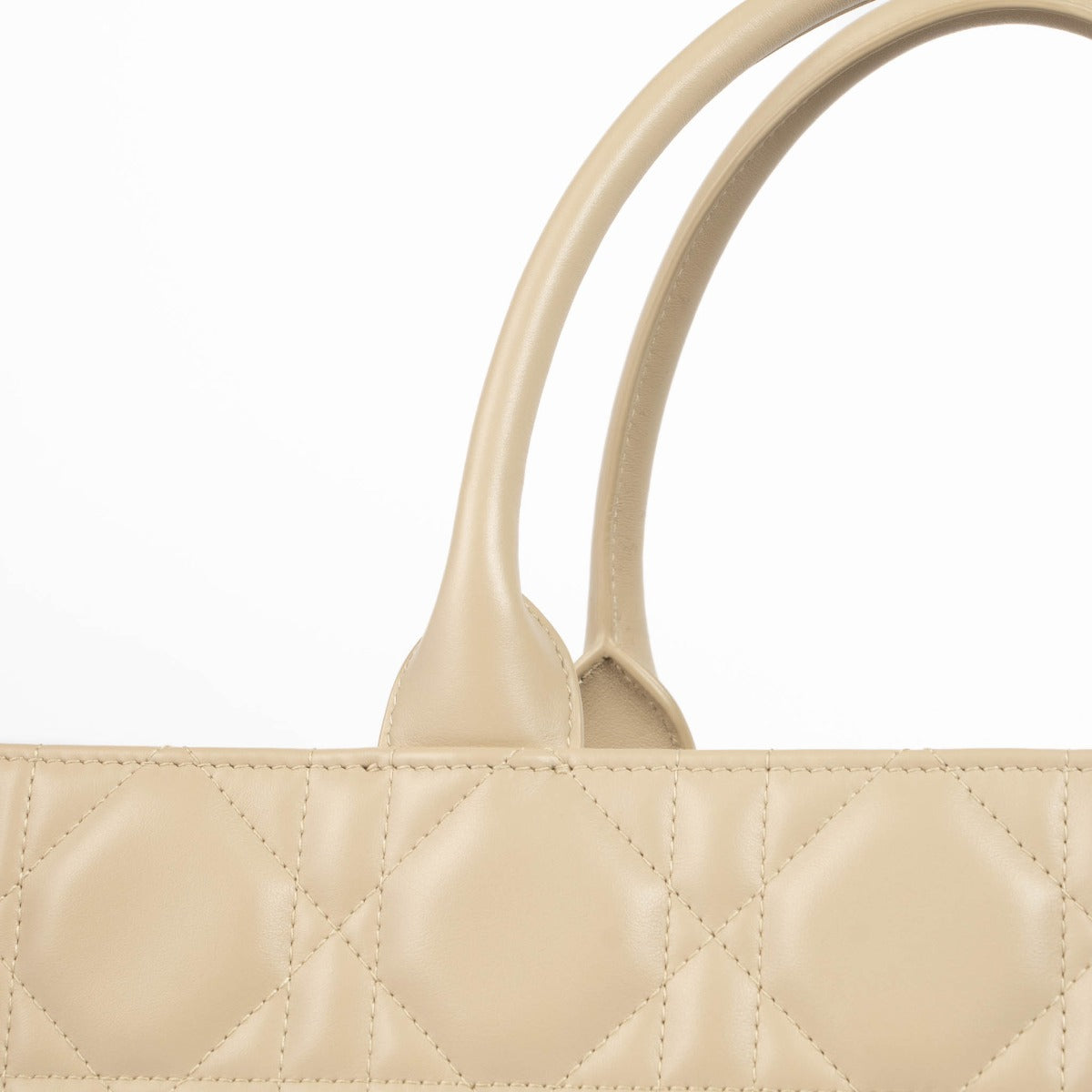 Christian Dior Book Tote sand embroidered canvas handbag, luxury designer tote with Dior logo pattern, neutral structured everyday bag for travel and city use