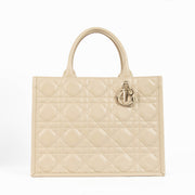 Christian Dior Book Tote sand embroidered canvas handbag, luxury designer tote with Dior logo pattern, neutral structured everyday bag for travel and city use