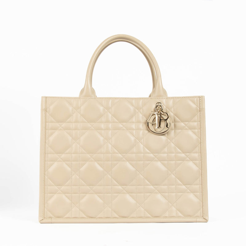 Christian Dior Book Tote sand embroidered canvas handbag, luxury designer tote with Dior logo pattern, neutral structured everyday bag for travel and city use